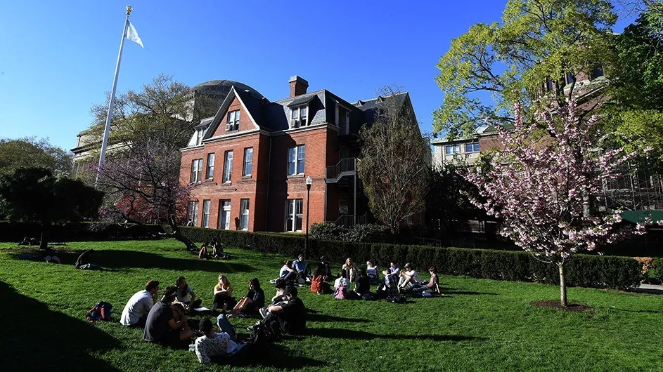 Columbia students in class outdoors on Morningside campus